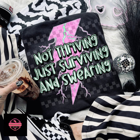 Not Thriving Just Surviving and Swearing Tee & Sweatshirt